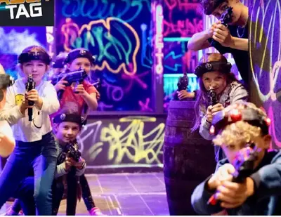 a group of children sitting on a stage holding microphones at Springer Villa, 2 bed, Newquay in Newquay
