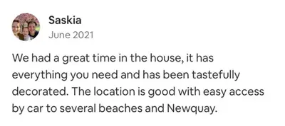 a screenshot of a text message with a picture of two people at Springer Villa, 2 bed, Newquay in Newquay