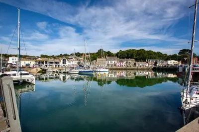 a marina with boats docked in the water at Trethvor House FREE PARKING Private bathroom Double in Padstow