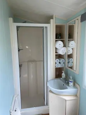 a bathroom with a shower and a sink at 93 Newquay Bay resort Pet friendly in Newquay