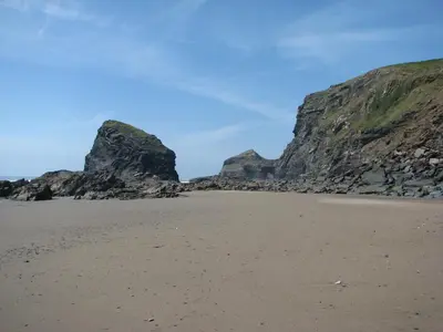 a view of the beach with cliffs in the background at Woodgate in Bude