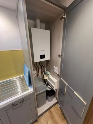 a small kitchen with a sink and a refrigerator at Citrus Chalet in Redruth