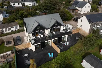 an aerial view of a house with a black roof at Lanyon in St Ives