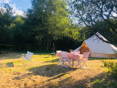 a table and chairs in front of a tent at Rose in St Austell