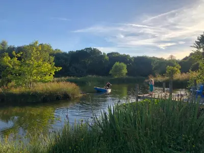 a couple of people in a boat on a river at Rose in St Austell
