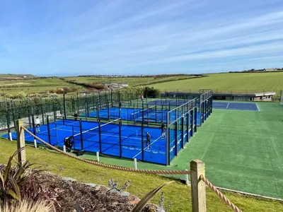 a group of tennis courts on a field at Trevose Golf and Country Club in Padstow