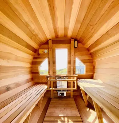 an inside view of a wooden sauna with benches at Rockpools in Porth