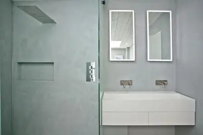 a bathroom with a sink and a mirror and a shower at Rockpools in Porth