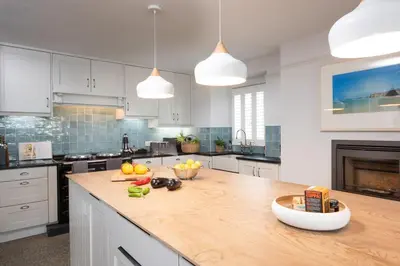 a kitchen with a wooden counter top with fruit on it at Watersend in Porth