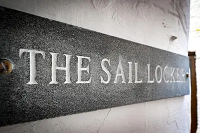 a sign that says the sales lobby on a wall at Luxury Couple's Getaway with River Views and Parking in Polperro