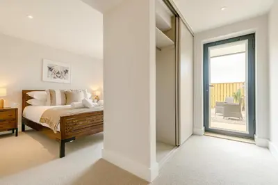 a bedroom with a bed and a large window at 2 Bed in Newquay oc-e26943 in Newquay