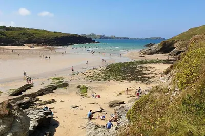 a group of people on a beach near the ocean at 2 Bed in Newquay oc-e26943 in Newquay