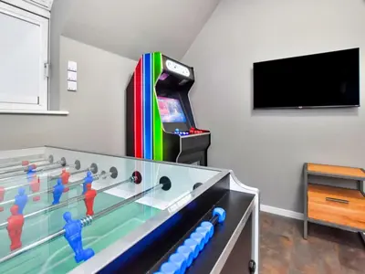 a kids room with a pool table and a video game at Finest Retreats - Beach House in Newquay
