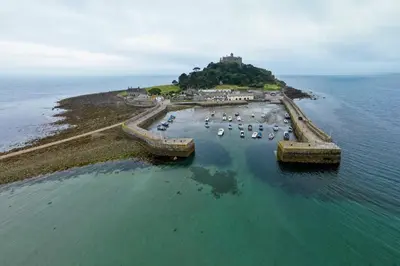 an island with a bunch of boats in the water at Mermaid - Pet Friendly Self Catering Holiday Cottage Hayle in Hayle