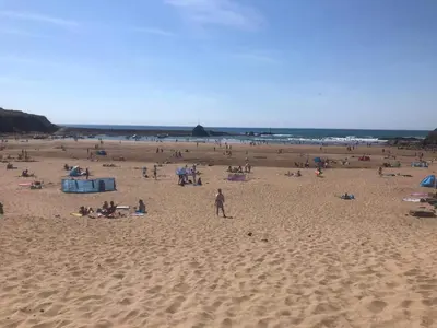 a large group of people on a beach at Fentrigan Manor Farm & Holiday Cottages in Bude