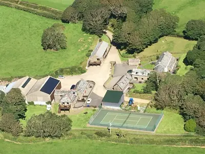 an aerial view of an estate with a tennis court at Fentrigan Manor Farm & Holiday Cottages in Bude