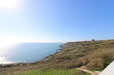a view of the ocean from the top of a hill at The Mariners in Helston