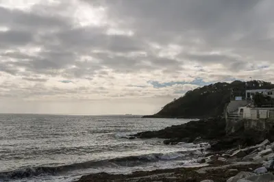 a view of the ocean on a cloudy day at Albert's Den in Falmouth