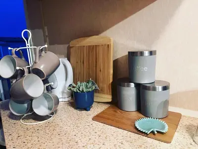 a group of coffee cups and pots on a counter at Seven Bays Holiday Home in Padstow