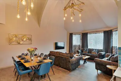 a living room with a table and chairs at Finest Retreats - Towan House in Newquay
