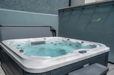 a bath tub with a fish on the side of it at Finest Retreats - Towan House in Newquay
