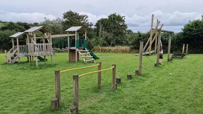 a park with a bunch of playground equipment at Roecliff in St Austell