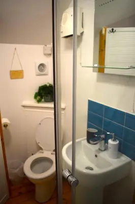 a bathroom with a toilet and a sink at The Little House, Wadebridge, Cornwall in Wadebridge