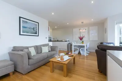 a living room with a couch and a table at 2 Four Seasons in St Ives