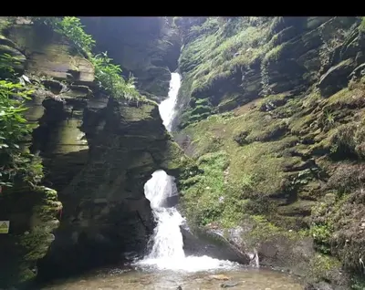a waterfall on the side of a mountain at New modern self contained Cottage in Delabole