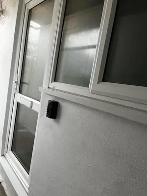 a door with a window on the side of a house at The Cosy Nook in Redruth