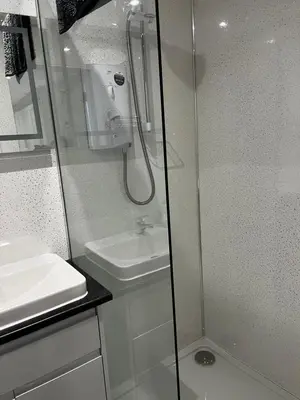 a bathroom with a shower and a sink at The Cosy Nook in Redruth