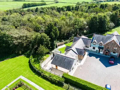 an aerial view of a house with a yard at Chy Pol in Wadebridge