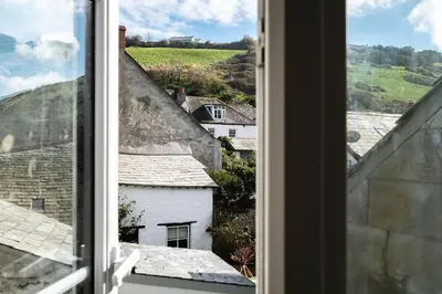 an open window with a view of roofs at Mobray, Port Isaac Bay Holidays in Port Isaac