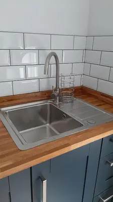 a stainless steel sink in a kitchen at Poldice Valley Apartments in Chacewater