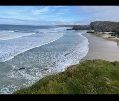 an aerial view of a beach with the ocean at NB166 - Porth Bay Hideaway in Porth
