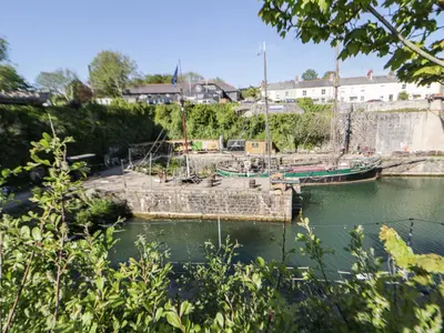 a couple of boats docked in a body of water at Pirata in St Austell
