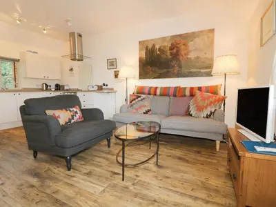 a living room with a couch and a table at Pirata in St Austell