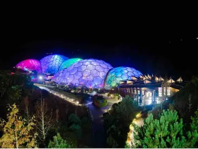 a group ofidium spheres lit up at night at Saint Chads Lodge Near EDEN Luxulyan in Luxulyan