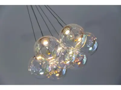a glass flower with lights on top of a table at Gwel An Keynvor Penthouse in Newquay