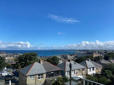 a view of a city with houses and the water at Gwel An Keynvor Penthouse in Newquay