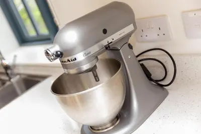 a mixer sitting on top of a kitchen counter at Carines Barns - Wesley Barn in Newquay