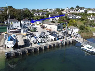 an aerial view of a marina with boats in the water at Polmaro in Saint Mawes