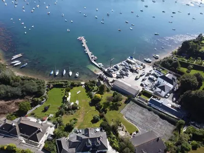 an aerial view of a harbor with boats in the water at Polmaro in Saint Mawes