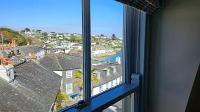 a window with a view of a city at Pennant in Saint Mawes
