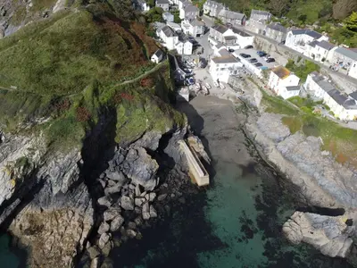 an aerial view of a village on the side of a cliff at Beach Hill Cottage in Portloe