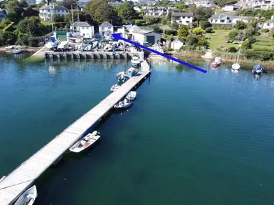 an aerial view of a dock with boats in the water at Pelyn in Saint Mawes