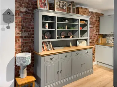 a kitchen with a large gray cabinet at Stream Side in Budock Water