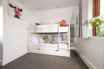 a white bunk bed in a childs room at Robins Rest - Pets welcome - Free Parking - Backgarden in Perranporth