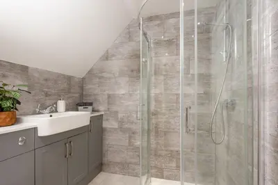 a bathroom with a shower and a sink at Robins Rest - Pets welcome - Free Parking - Backgarden in Perranporth