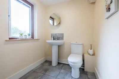 a bathroom with a toilet and a sink at Robins Rest - Pets welcome - Free Parking - Backgarden in Perranporth